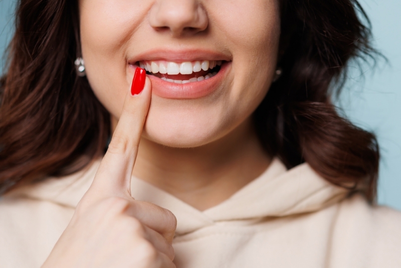 Close up of woman's nice smile with a dental crown in Calgary